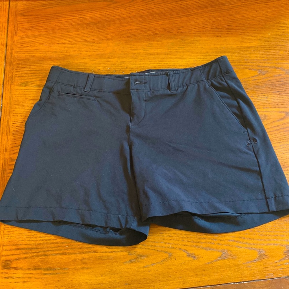 Under Armour 5” Women’s black golf shorts.